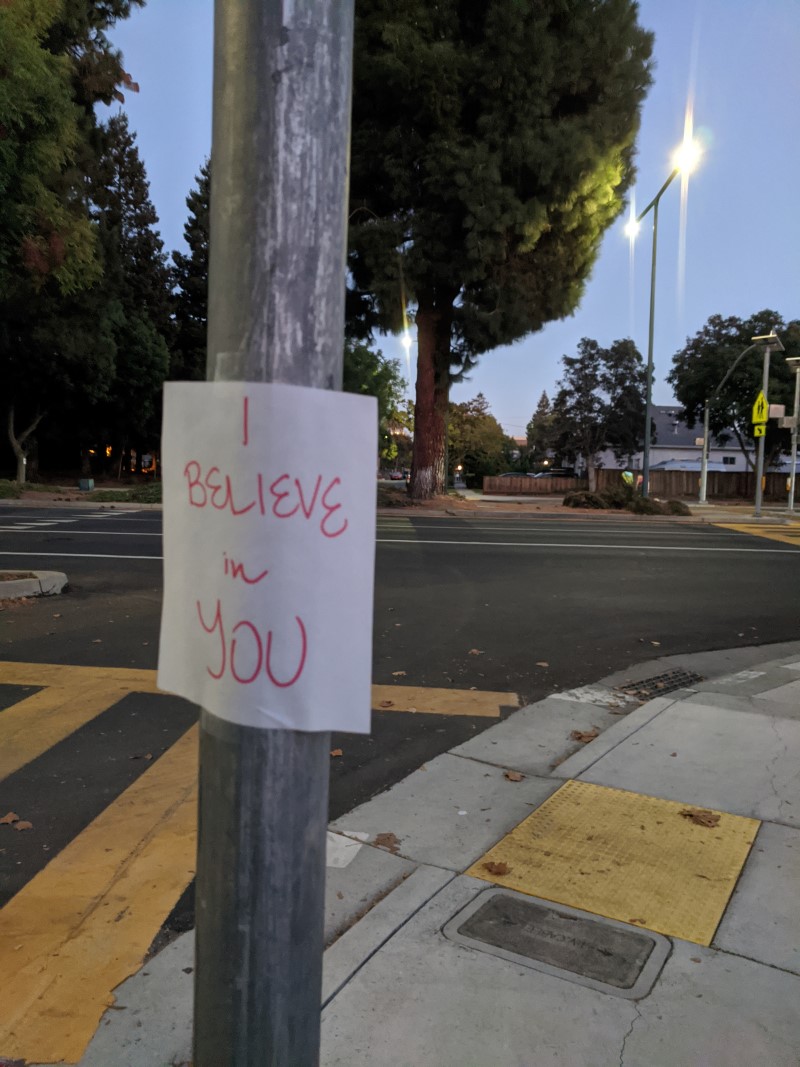 hand-written sign saying "I believe in you"
