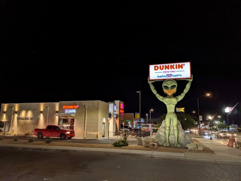 dunkin donuts alien wearing a mask