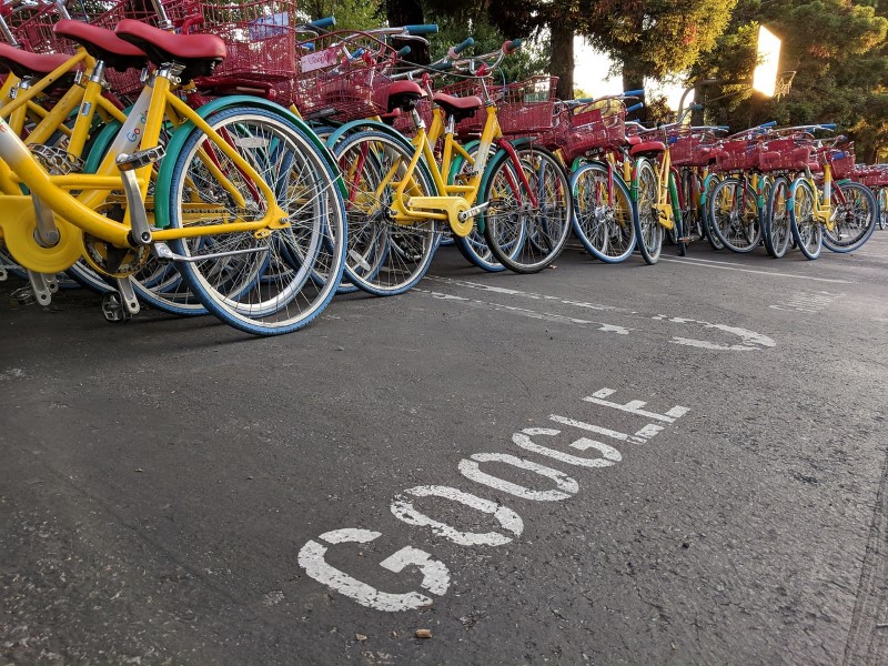 Google bikes in a parking lot